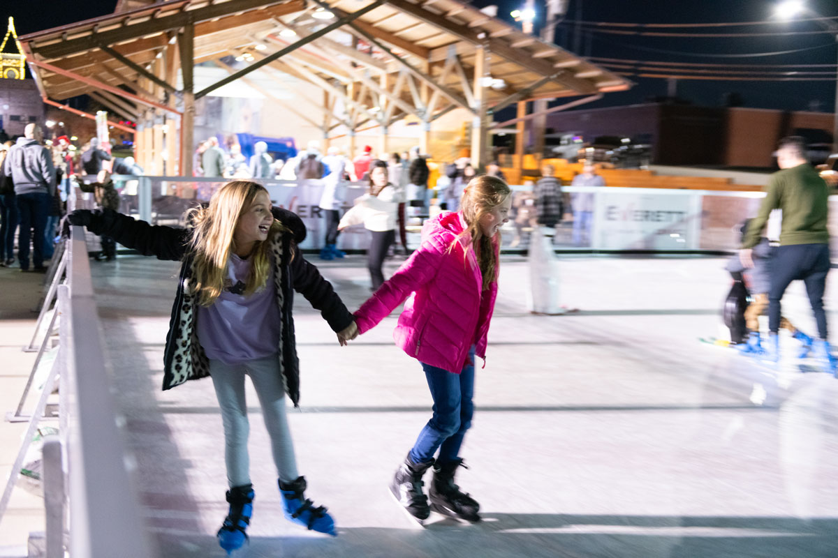 Girls Ice Skating at Outdoor Rink in Benton